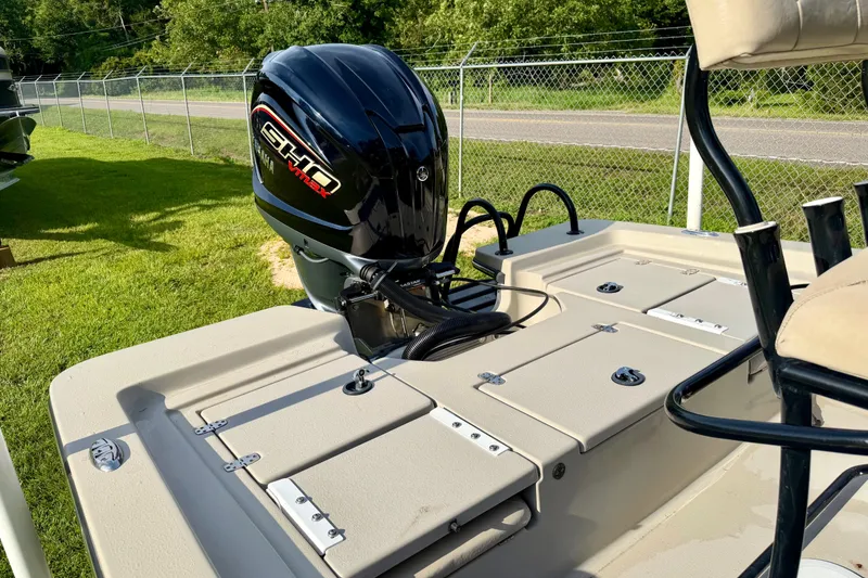 Slide: The Image of 2015 Blazer Bay 2200 Fisherman boat with Yamaha VMAX engine, parked on grass. - 9