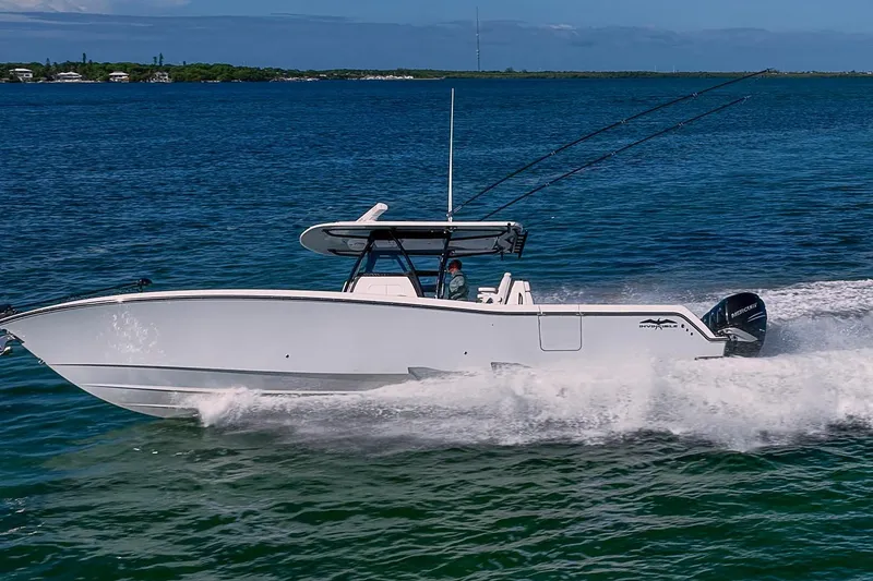 Slide: The Image of 2022 Invincible 39 Open Fisherman boat cruising on blue ocean waters. - 36