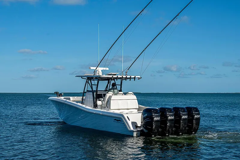 Slide: The Image of 2022 Invincible 39 Open Fisherman boat with four powerful engines on open water. - 5