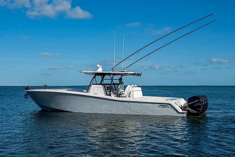 Slide: The Image of 2022 Invincible 39 Open Fisherman boat on calm ocean waters under clear blue sky. - 1