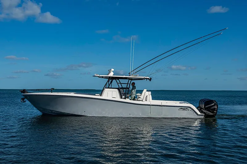 The Image of 2022 Invincible 39 Open Fisherman boat on calm ocean waters under clear blue sky. - 0