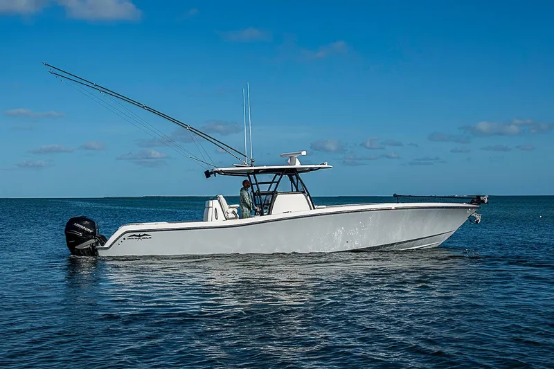 Slide: The Image of 2022 Invincible 39 Open Fisherman boat on calm blue water under clear sky. - 77