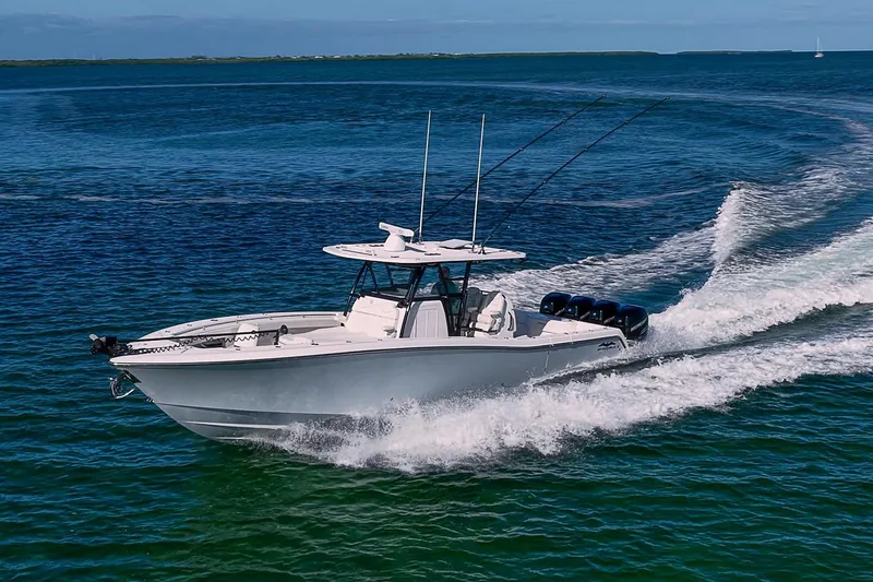 Slide: The Image of 2022 Invincible 39 Open Fisherman boat cruising on clear blue water. - 39