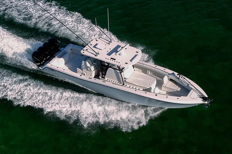 Slide: The Image of 2022 Invincible 39 Open Fisherman boat cruising on clear green water. - 33