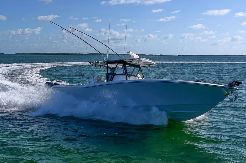 Slide: The Image of 2022 Invincible 39 Open Fisherman boat cruising on open water, creating a dynamic wake. - 28