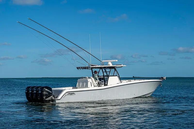 Slide: The Image of 2022 Invincible 39 Open Fisherman boat on calm ocean waters under clear blue sky. - 9
