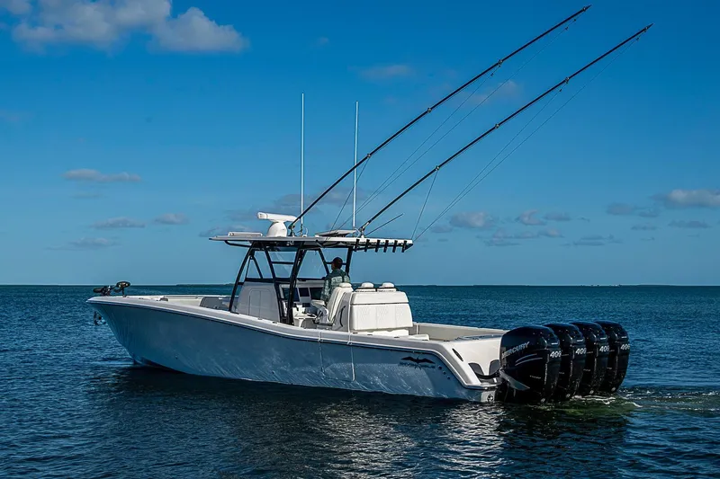 Slide: The Image of 2022 Invincible 39 Open Fisherman boat on calm ocean waters under blue sky. - 3