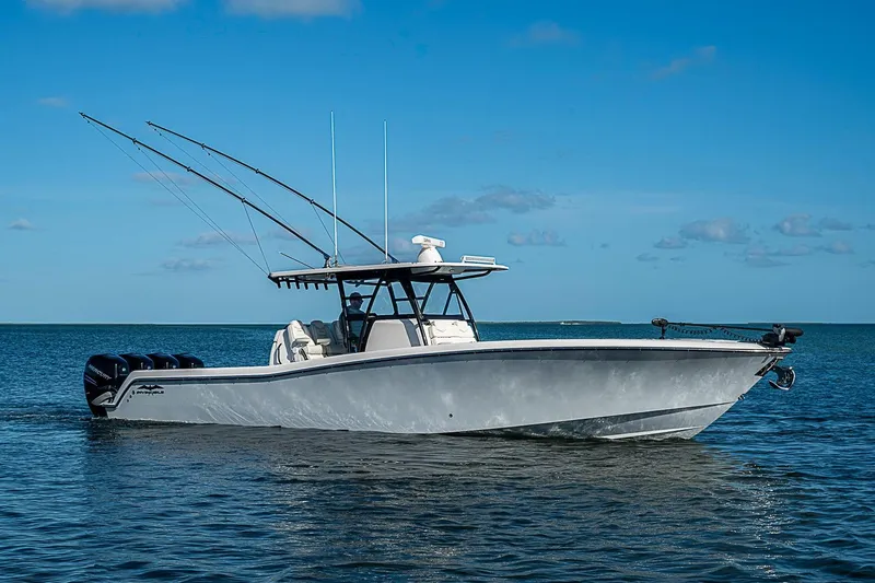 Slide: The Image of 2022 Invincible 39 Open Fisherman boat on calm ocean waters under clear blue sky. - 12