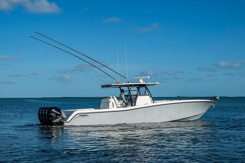 Slide: The Image of 2022 Invincible 39 Open Fisherman boat on calm ocean waters under clear blue sky. - 10