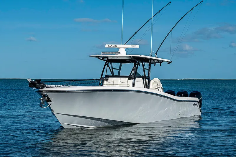 Slide: The Image of 2022 Invincible 39 Open Fisherman boat on calm blue water. - 16