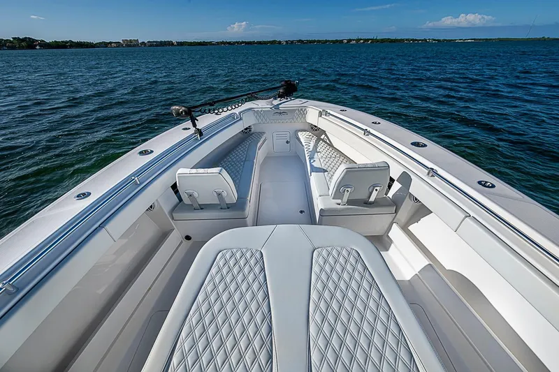 Slide: The Image of 2022 Invincible 39 Open Fisherman boat interior with luxurious seating on open water. - 43