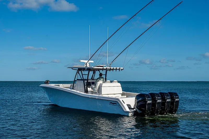 Slide: The Image of 2022 Invincible 39 Open Fisherman boat with four powerful engines on open water. - 4
