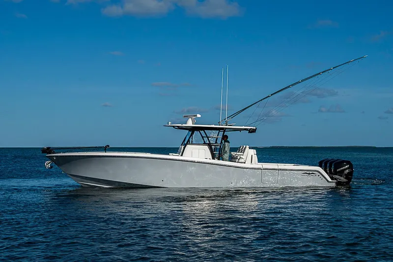 Slide: The Image of 2022 Invincible 39 Open Fisherman boat on calm ocean waters under clear blue sky. - 19