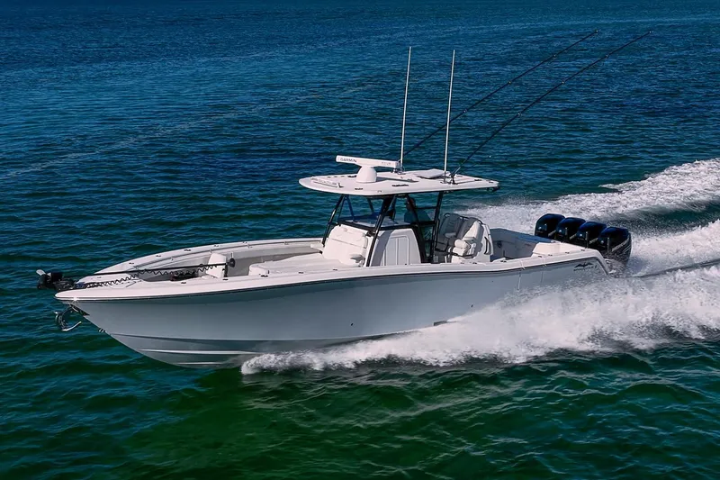 Slide: The Image of 2022 Invincible 39 Open Fisherman boat cruising on clear blue water. - 35