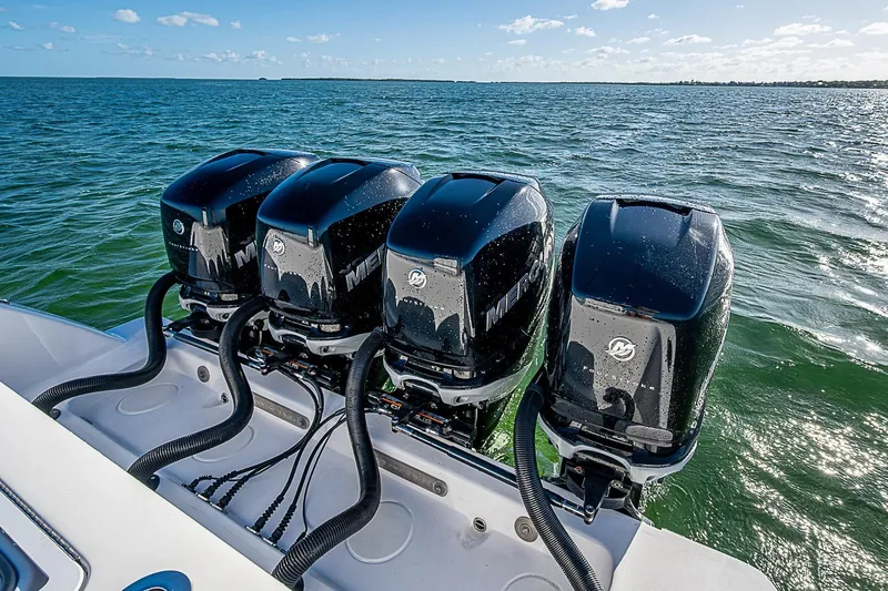 Slide: The Image of 2022 Invincible 39 Open Fisherman with four powerful Mercury outboard engines on open water. - 64