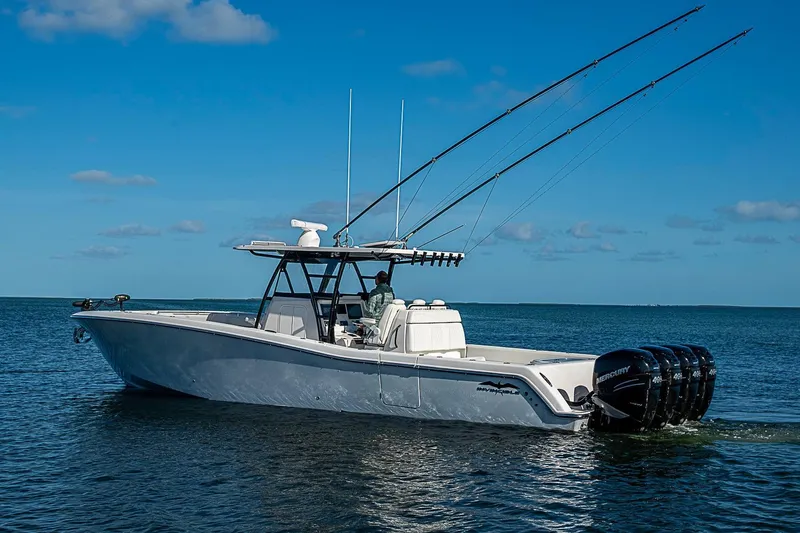 Slide: The Image of 2022 Invincible 39 Open Fisherman boat on calm ocean waters under clear blue sky. - 2