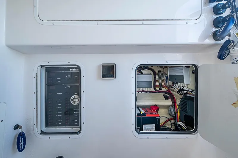 Slide: The Image of Electrical panel and wiring inside a 2022 Invincible 39 Open Fisherman boat. - 70