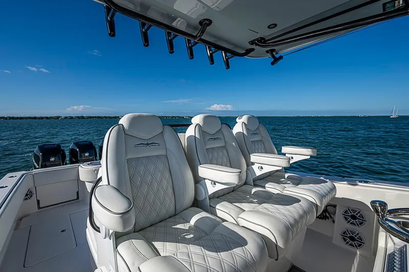 Slide: The Image of 2022 Invincible 39 Open Fisherman boat with luxurious seating on open water. - 76