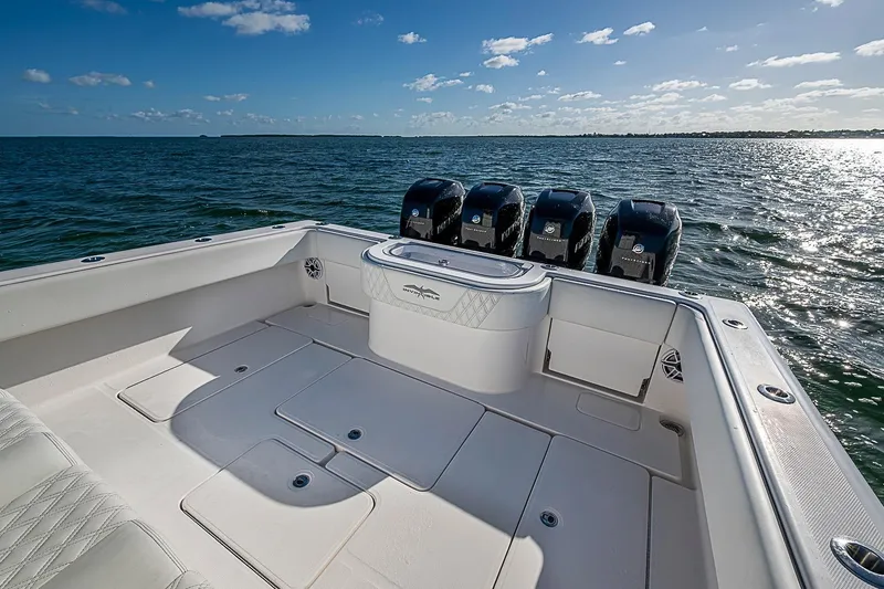 Slide: The Image of 2022 Invincible 39 Open Fisherman boat with multiple engines on open water. - 56