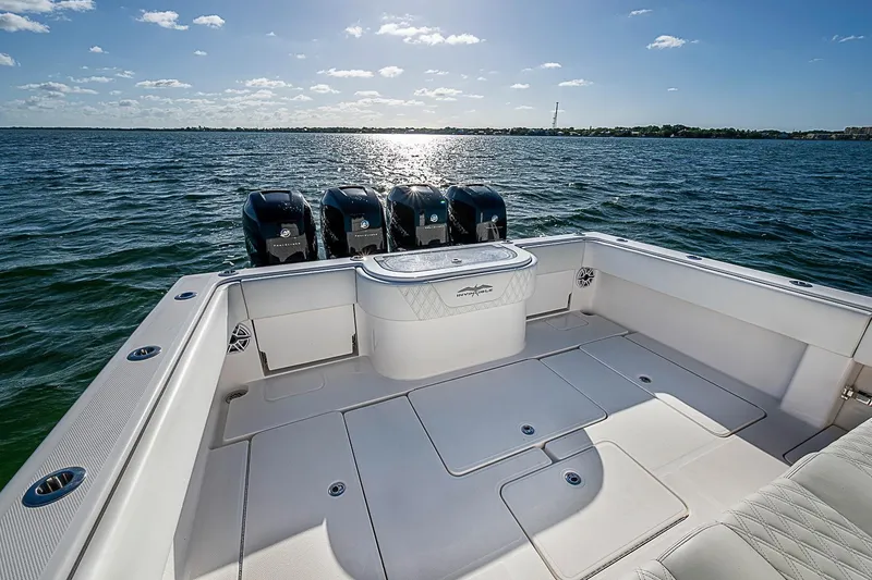 Slide: The Image of 2022 Invincible 39 Open Fisherman boat with four engines on open water. - 55