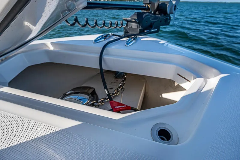 Slide: The Image of Open anchor compartment on 2022 Invincible 39 Open Fisherman boat, with visible chain and equipment. - 47