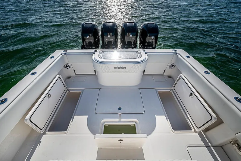 Slide: The Image of 2022 Invincible 39 Open Fisherman boat with four powerful engines on open water. - 59