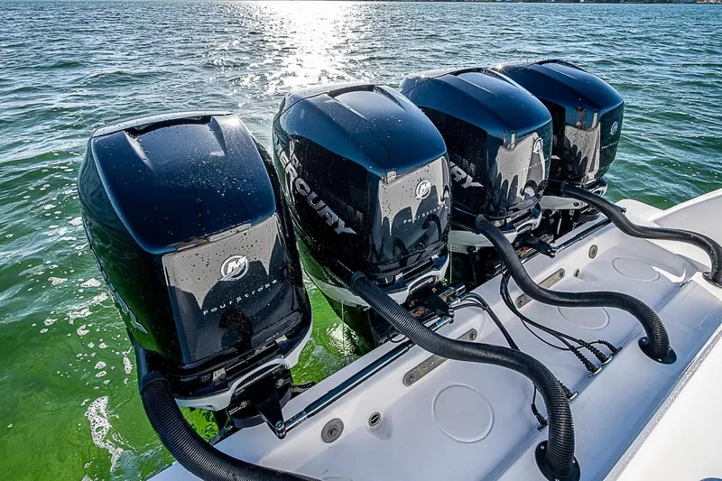 Slide: The Image of Four powerful Mercury outboard engines on a 2022 Invincible 39 Open Fisherman boat. - 66