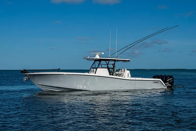 Slide: The Image of 2022 Invincible 39 Open Fisherman boat on calm ocean waters under clear blue sky. - 18