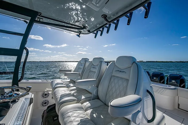 Slide: The Image of Luxurious seating on 2022 Invincible 39 Open Fisherman boat, ocean view in background. - 75