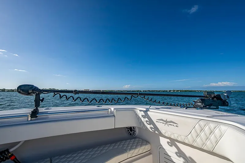 Slide: The Image of 2022 Invincible 39 Open Fisherman boat on water, clear sky, and scenic horizon. - 46
