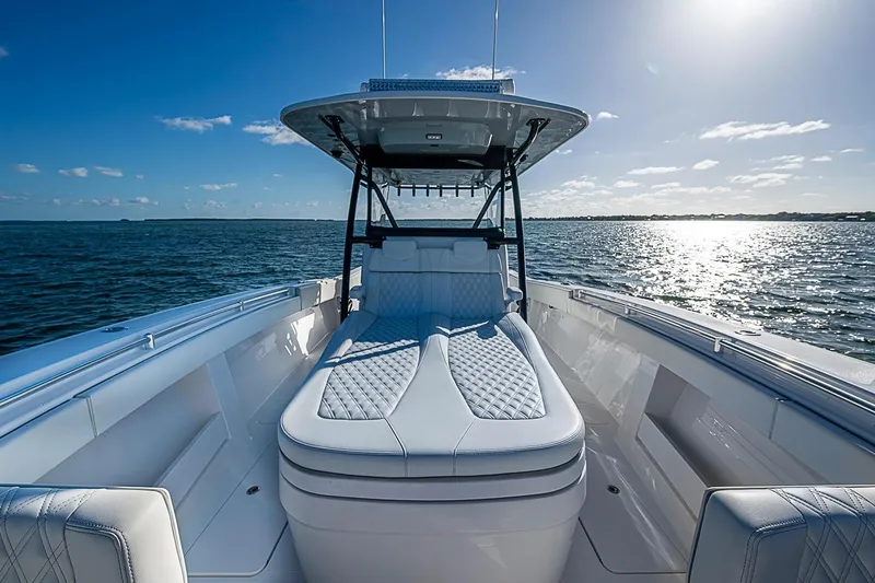 Slide: The Image of 2022 Invincible 39 Open Fisherman boat on calm ocean waters under clear blue sky. - 51