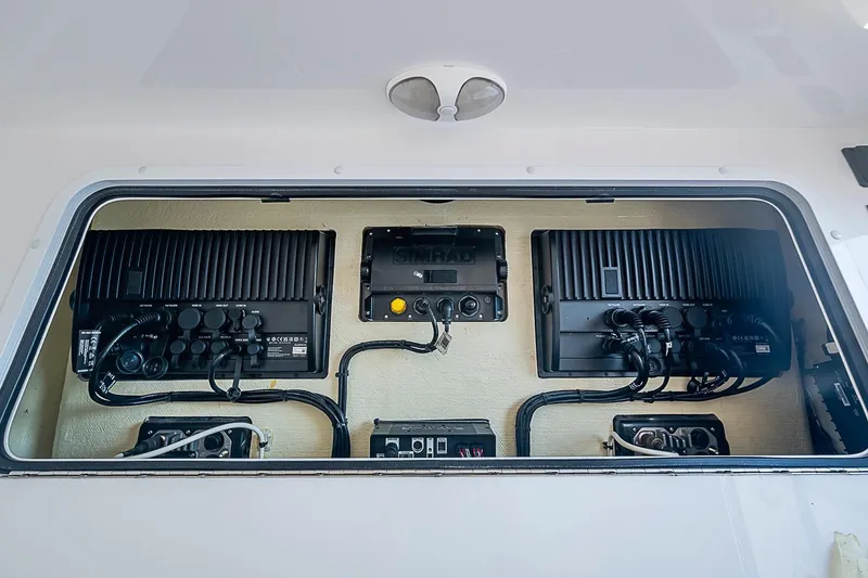 Slide: The Image of 2022 Invincible 39 Open Fisherman electronics panel with advanced navigation systems. - 69