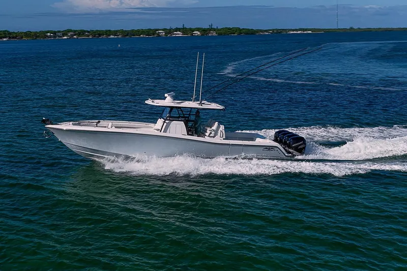 Slide: The Image of 2022 Invincible 39 Open Fisherman boat cruising on blue ocean waters. - 40