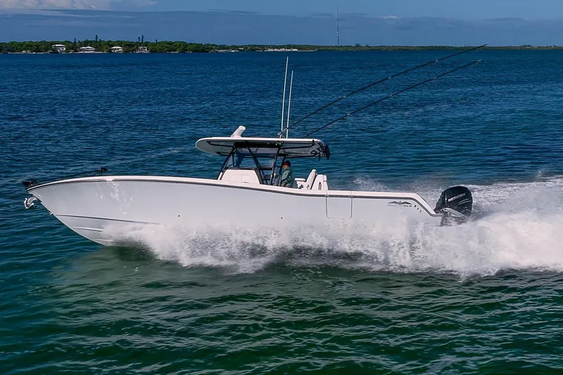 Slide: The Image of 2022 Invincible 39 Open Fisherman boat cruising on blue ocean waters. - 37
