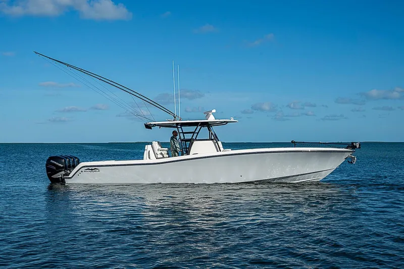 Slide: The Image of 2022 Invincible 39 Open Fisherman boat on calm ocean waters under clear blue sky. - 11