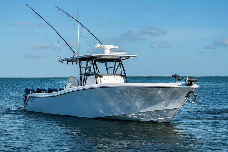 Slide: The Image of 2022 Invincible 39 Open Fisherman boat on calm ocean waters. - 13