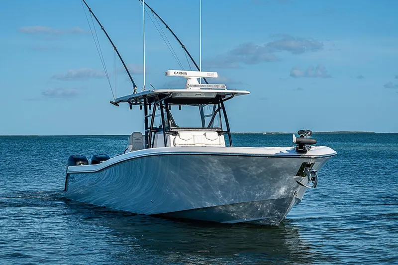Slide: The Image of 2022 Invincible 39 Open Fisherman boat on calm blue water. - 14