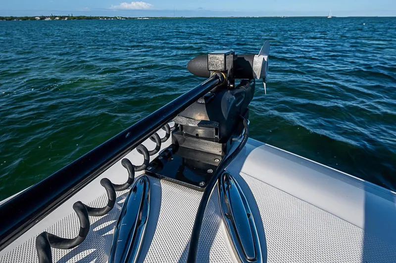 Slide: The Image of 2022 Invincible 39 Open Fisherman boat on water, featuring a trolling motor. - 48