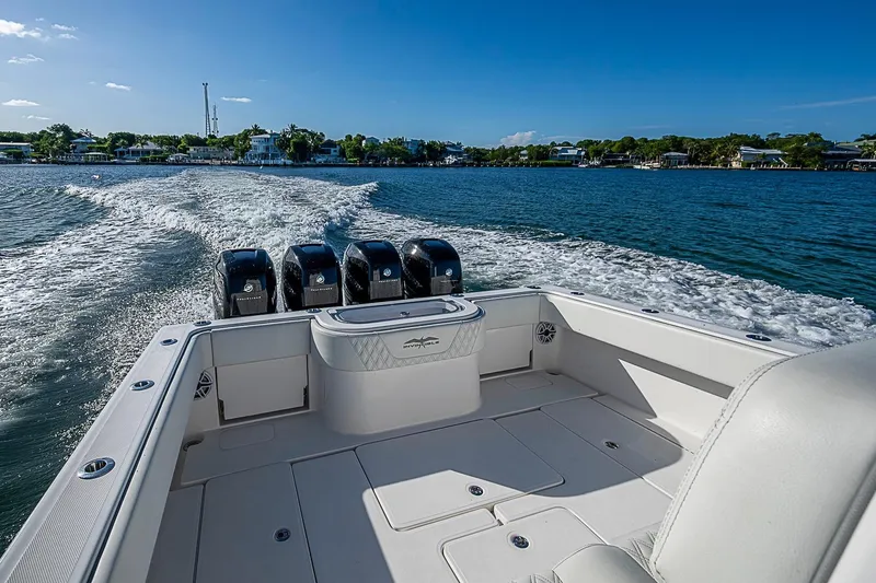 Slide: The Image of 2022 Invincible 39 Open Fisherman cruising on a sunny day, showcasing powerful engines. - 54