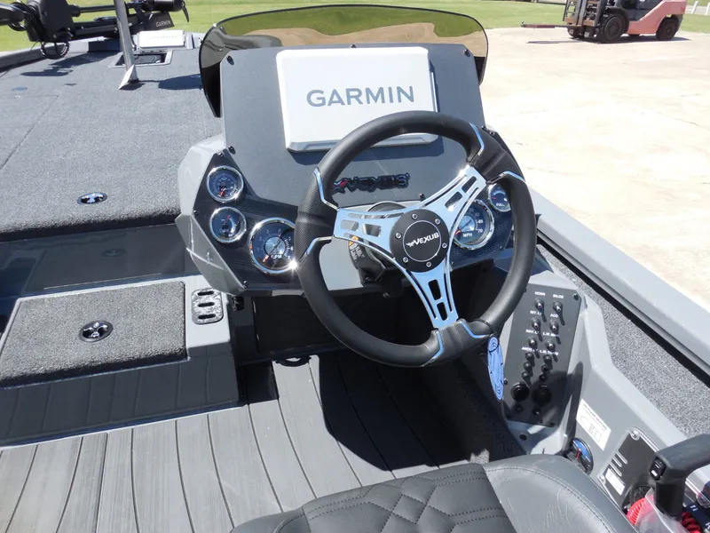 Slide: The Image of Interior view of Vexus AVX 1980 boat, 2026 model, featuring Garmin controls. - 12