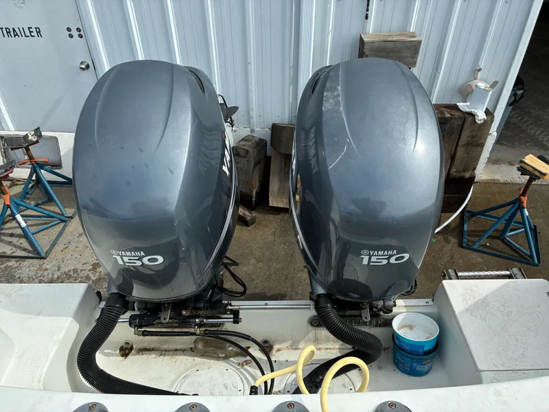 Slide: The Image of Two Yamaha 150 outboard motors on a 2007 Sailfish 2660 boat. - 22