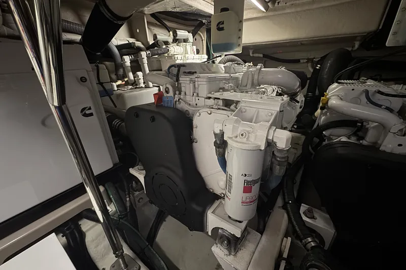 Slide: The Image of Engine room of 2016 Sea Ray L590 Fly yacht, showcasing mechanical components and systems. - 10