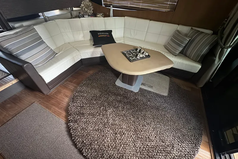 Slide: The Image of Luxurious interior of 2016 Sea Ray L590 Fly yacht with plush seating and elegant decor. - 13