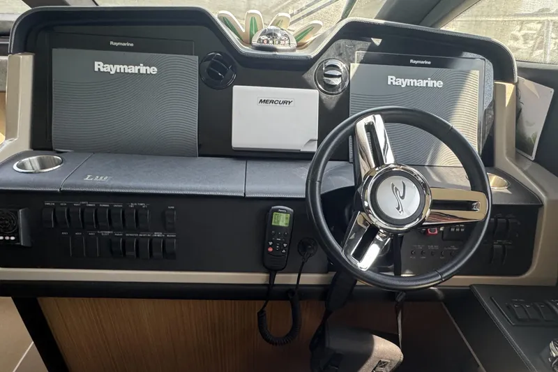 Slide: The Image of Cockpit of 2016 Sea Ray L590 Fly yacht with Raymarine displays and steering wheel. - 15