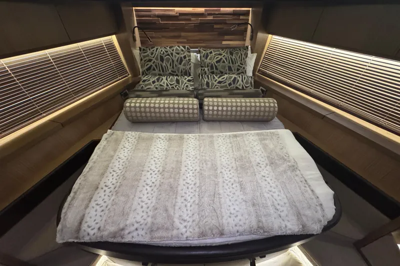 Slide: The Image of Luxurious bedroom interior of 2016 Sea Ray L590 Fly yacht with elegant bedding and decor. - 16
