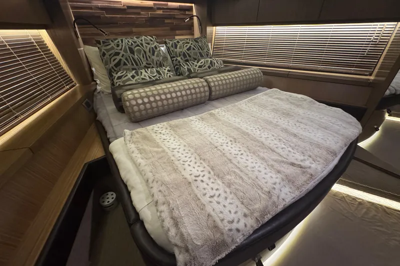 Slide: The Image of Luxurious bedroom interior of 2016 Sea Ray L590 Fly yacht with plush bedding. - 18
