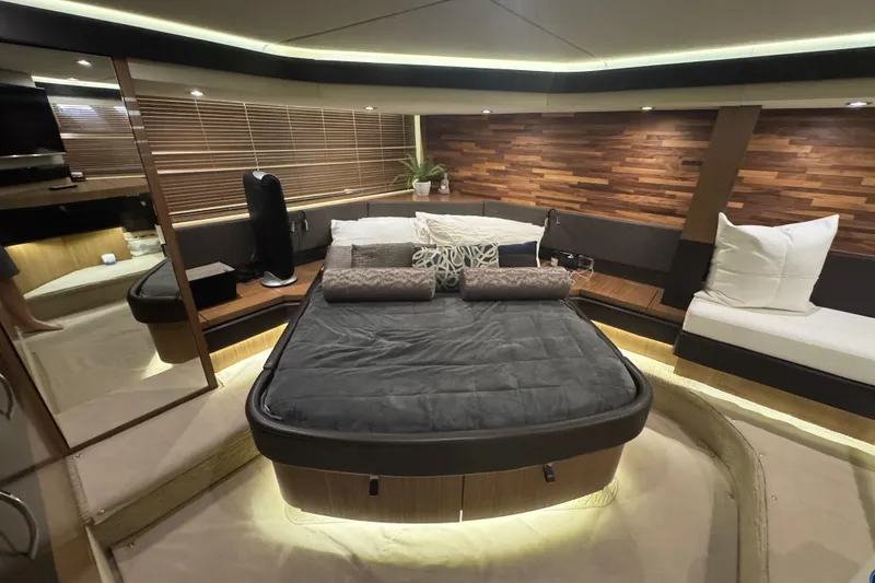 Slide: The Image of Luxurious 2016 Sea Ray L590 Fly yacht bedroom with modern decor and ambient lighting. - 21