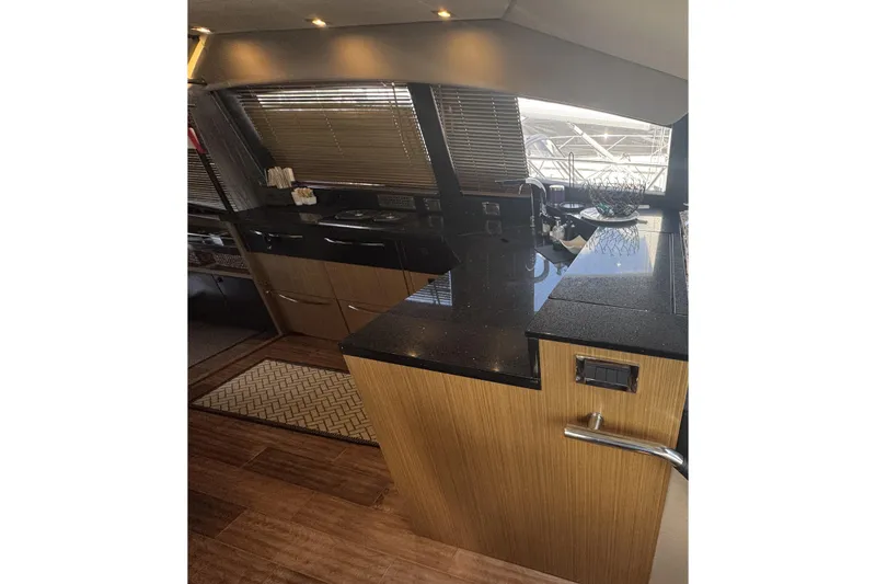 Slide: The Image of Luxurious interior of 2016 Sea Ray L590 Fly yacht with modern kitchen design. - 27