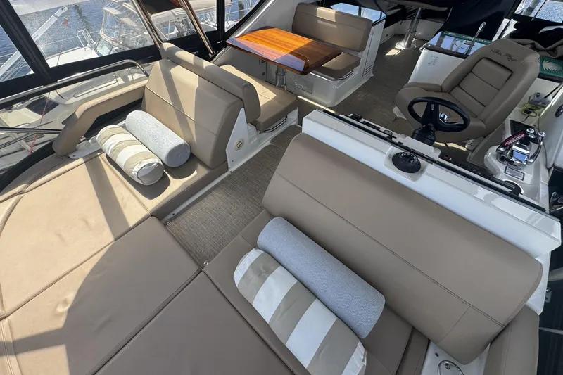 Slide: The Image of Cockpit of 2016 Sea Ray L590 Fly yacht with Raymarine displays and steering wheel. - 32
