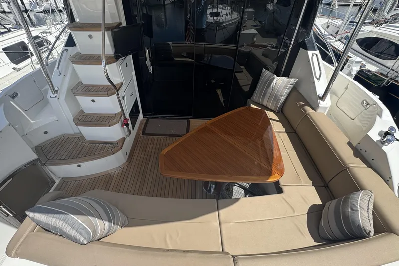 Slide: The Image of Luxurious bedroom interior of 2016 Sea Ray L590 Fly yacht with plush bedding and elegant decor. - 34